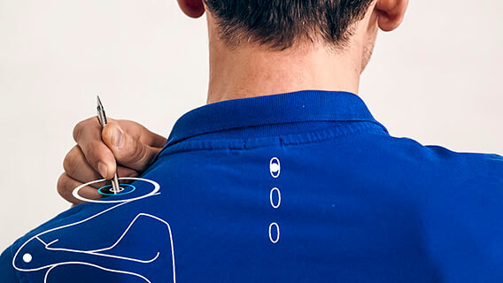 Upper back with graphic, position of acupuncture point GB 21 is shown with AkuPen