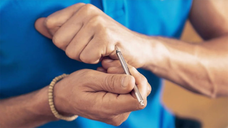 Pressing an acupoint on the hand with the acupen