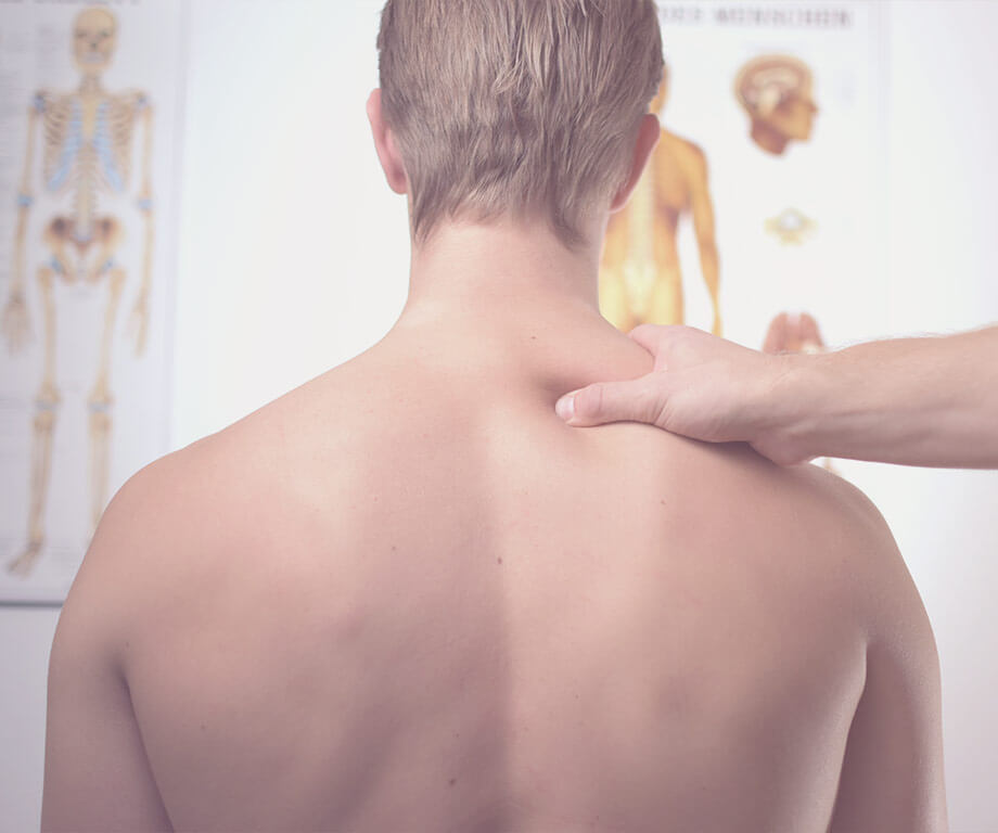 Man is pressed one acupressure point on the back
