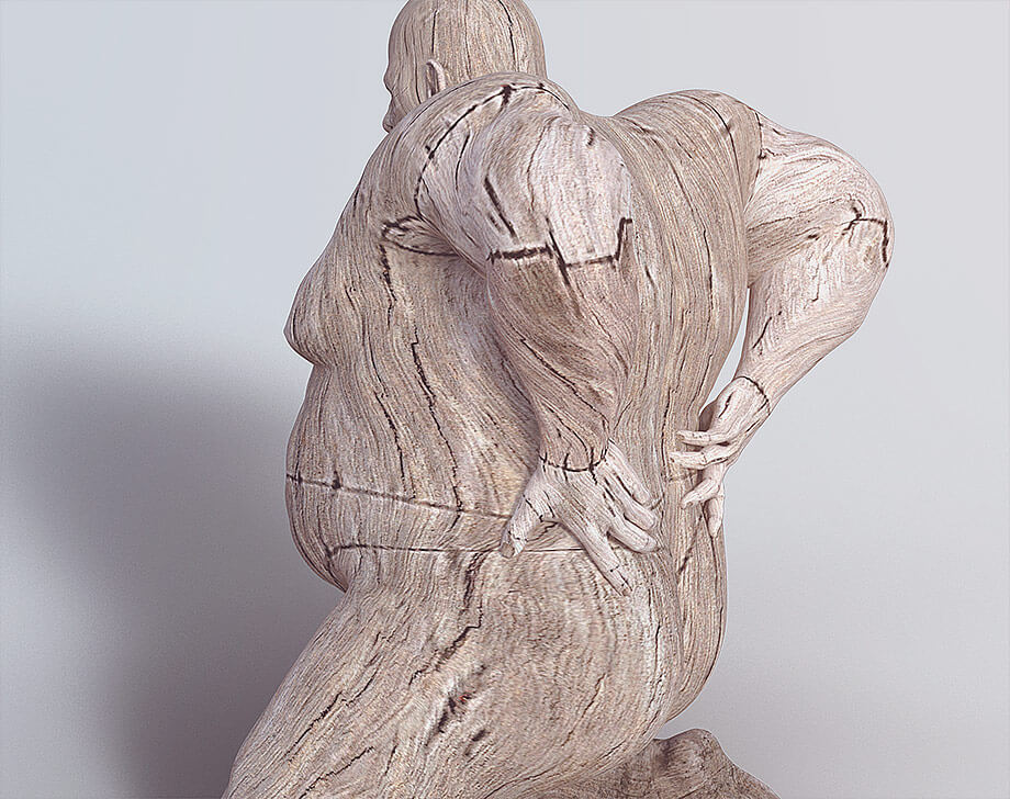 Wooden figure in pose, suggesting back pain