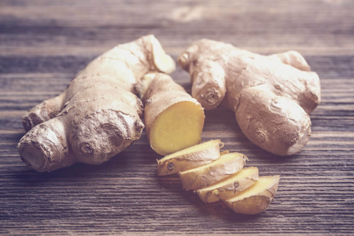 Two ginger roots, one root partially cut open