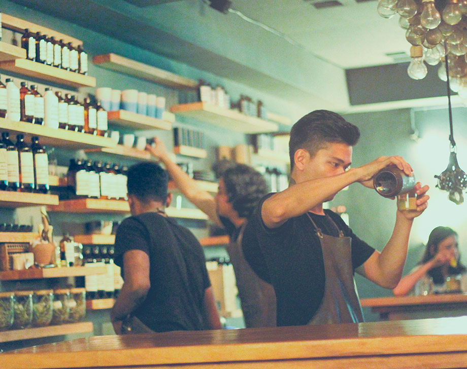 Chinese pharmacy, young man fills prescription