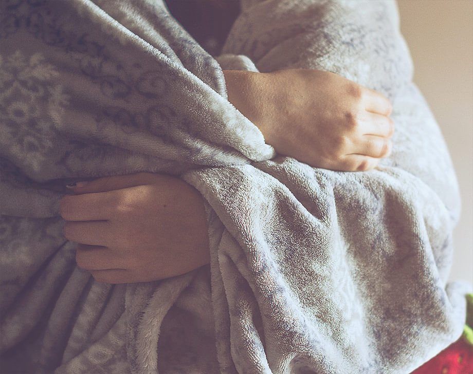 Woman wrapped in blanket