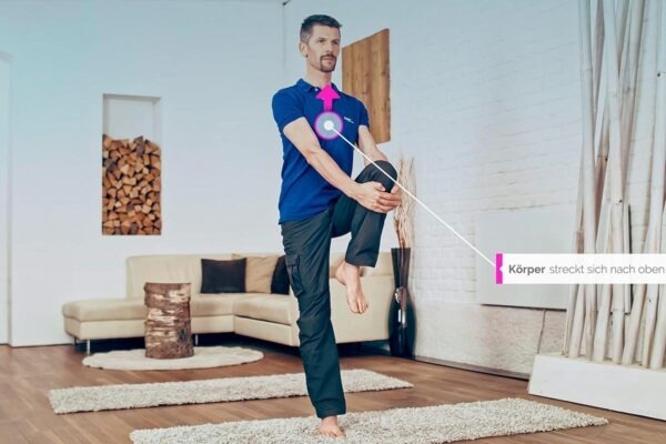 Wolfgang doing the meridian yoga exercise tree for the stomach meridian with watchpoint drawn in