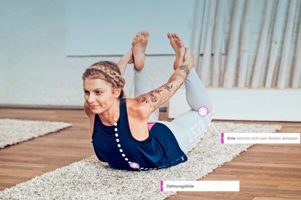 Kati doing the meridian yoga exercise The arch for the stomach meridian with stretch line drawn in